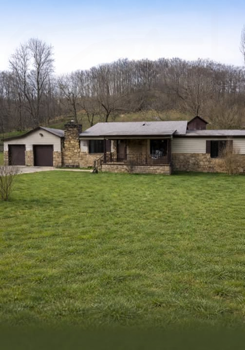 Charming Ranch-Style Home with Stone Accents and Peaceful Outdoor Living