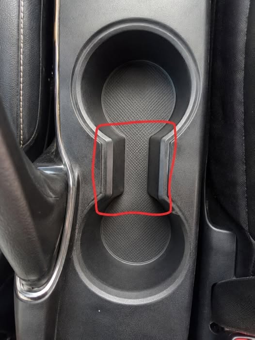 The Hidden Purpose of the Gap Between Car Cup Holders